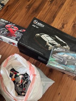 Car model kits and bag of legos