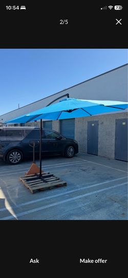 Brand new 10 foot patio umbrella with stand for $60