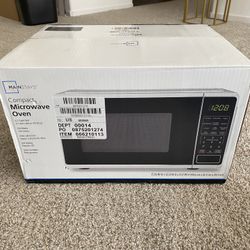 New MAINSTAYS compact microwave (unopened)