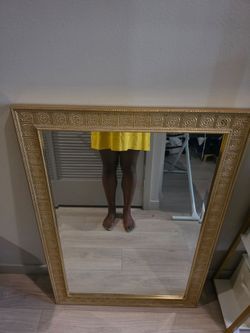 Large gold-framed mirror