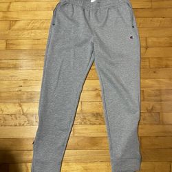Champions joggers with zip on bottom size MEDIUM