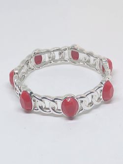 Silver tone bracelet with faux red stones