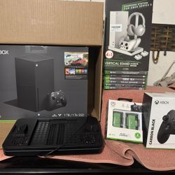 X-Box X  And All Accessories Included Along With Games, Cooling Systems Included, Rechargeable Batteries Extra Controller, Stand, System Still Brand N