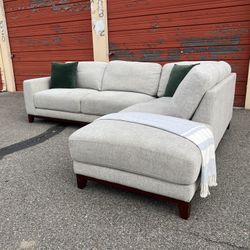 Gray Living Spaces sectional sofa couch with right facing chaise