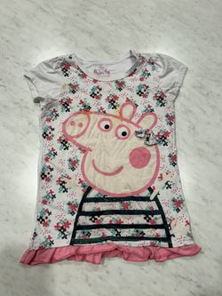 Peppa Pig themed kids t-shirt with floral design.