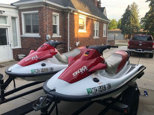 2 kawasaki jetskis 900 sts with dual trailer