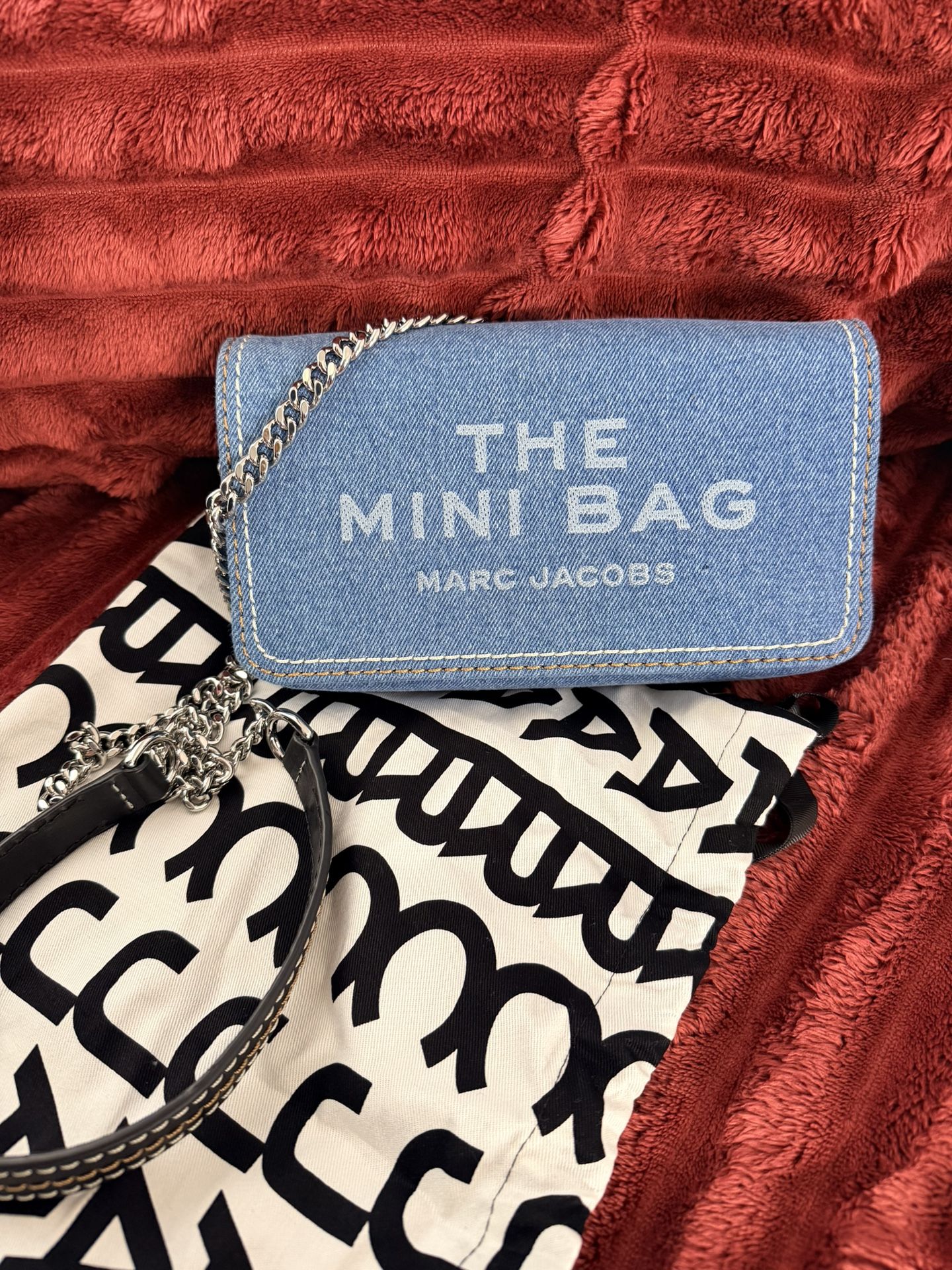 Marc Jacobs The Denim Chain Mini Bag in light wash denim. 