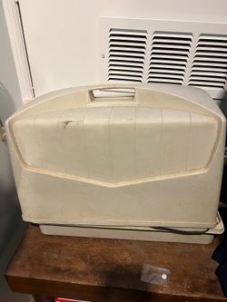 Electric sewing machine with cover