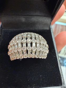 18 Karat White Gold Diamond Baguette Cocktail ring  A combination of baguette and round brilliant cocktail ring.  Ninety-one round brilliant diamonds 