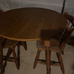  vintage 35.5”round laminate table w/wooden legs $40, traditional country style wood chairs  $20 
