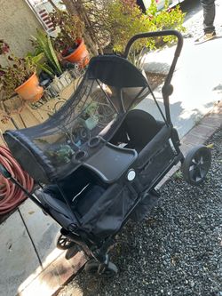 WAGON STROLLER PULL AND PUSH ALMOST NEW!  USED ONLY SOMETIMES!  VERY CLEAN!