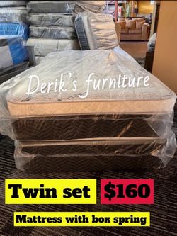 Twin size pillow top mattress with box spring