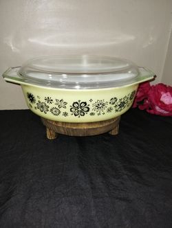 Vintage 1957  Cradled Decorator Casserole-  Flower pattern in matte black on pale yellow 045 oval casseroles with  glass lid and cradle.  2.5 Qt
