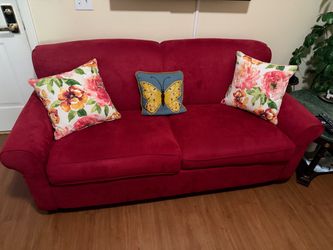 Red couch with pull out bed