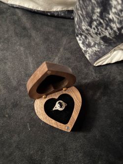 Oval black onyx diamond promise ring with heart shaped box