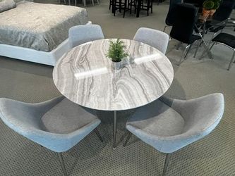 5 pc  dining table faux marble  45" round gray chairs with chrome legs 