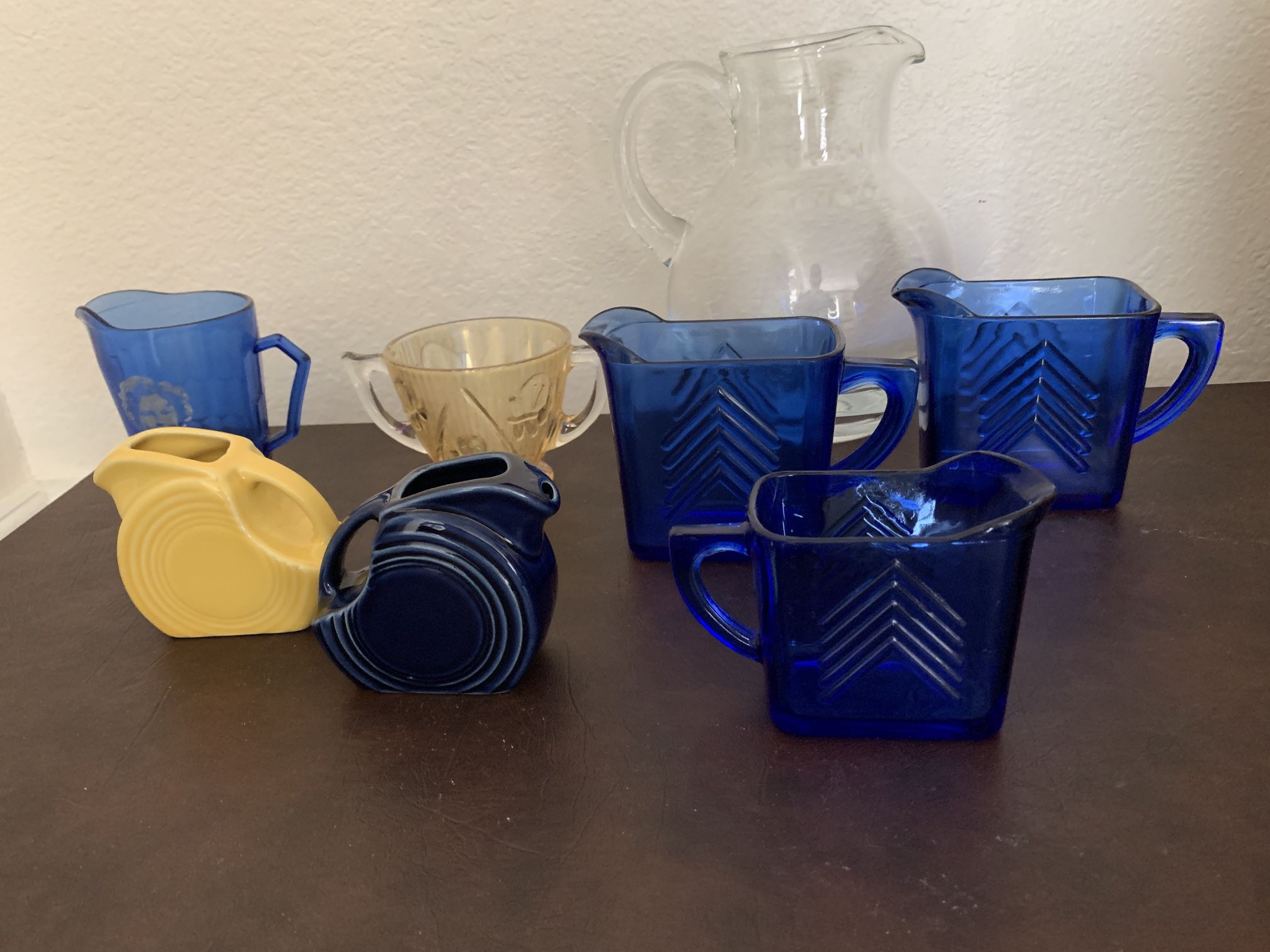 depression glass and vintage creamers sugars $17 each. cobalt blue Shirley Temple fiesta ware