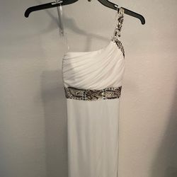 Long white evening dress. One shoulder style with open back. Sequin details. Size 7. New with tags