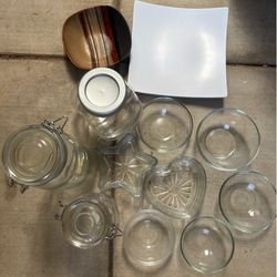 Glass bowls and bottles, each sold for...