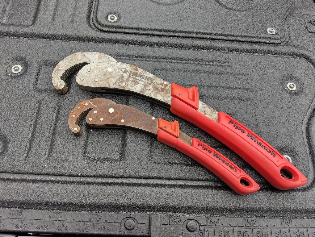 TWO HUSKY PIPE WRENCHES.