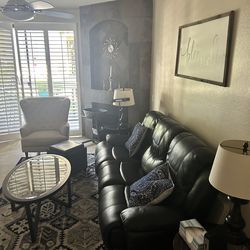 Leather could with electric lounger on both ends