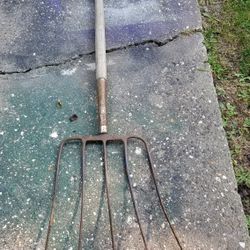 Pich Fork. Long Teeth in front there is tape on handle