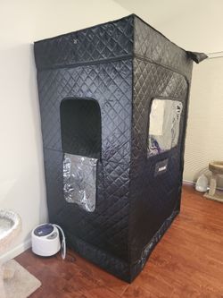 Collapsible portable steam room with two water dispensers