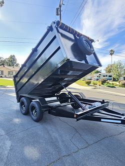 NEW DUMP TRAILER 12X8X4 HYDRAULIC SYSTEM,ROLLING TARP,SPARE TIRE,REMOTE CONTROL,EMERGENCY BRAKES TITLE IN HAND READY FOR WORK FOR SOME QUESTION TEXT M