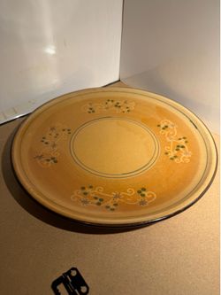Brown ceramic plate with flower details