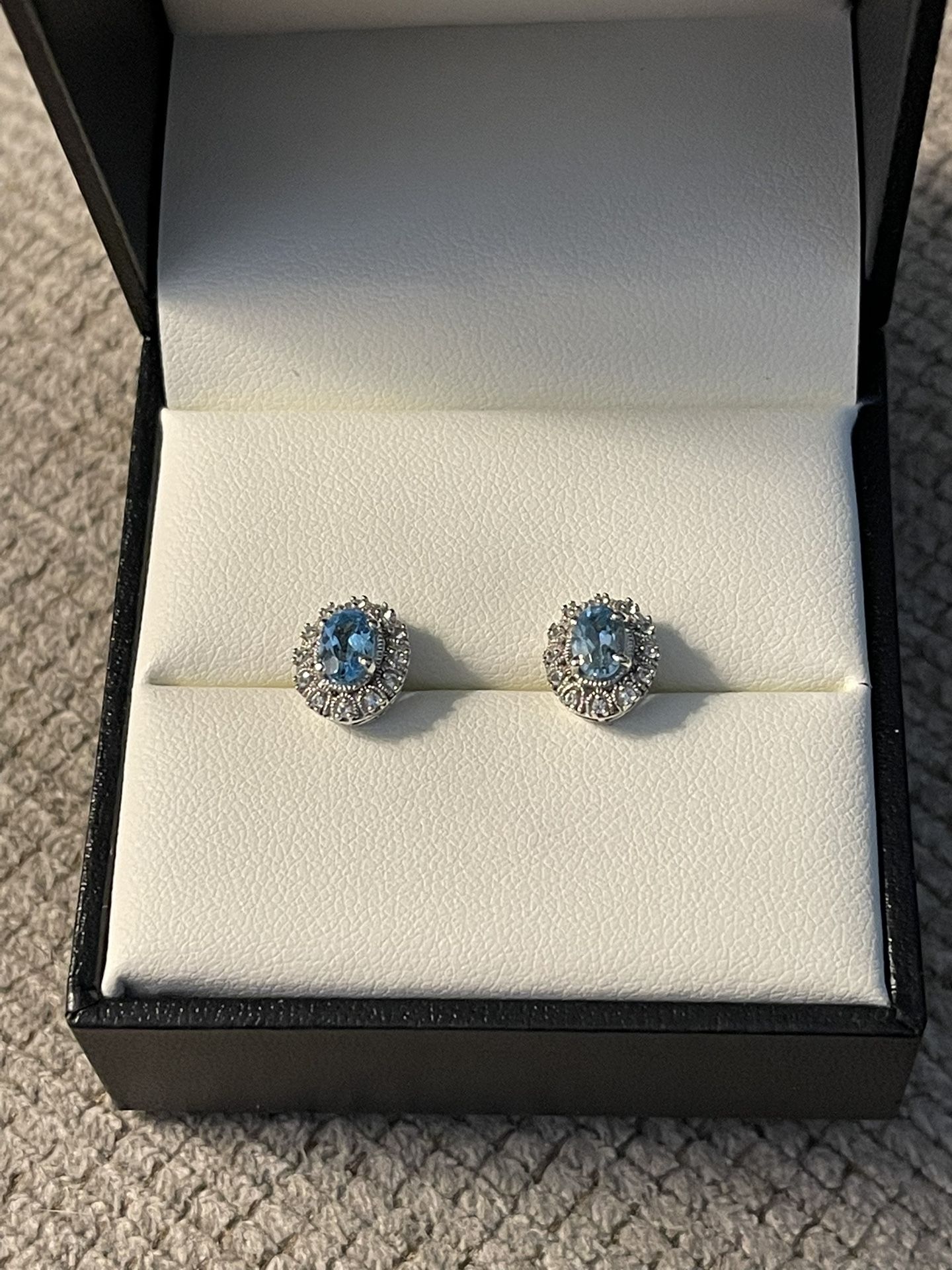 Blue topaz with diamond accents in Sterling silver earrings