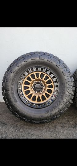 17" KMC KM552 w/ 33x12.50R17 Toyo AT3 tires