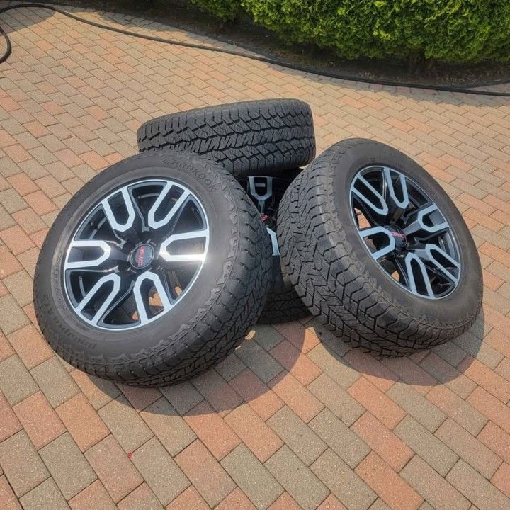 GMC Sierra Rims And Tires With 70% Tread 275 60 R20
