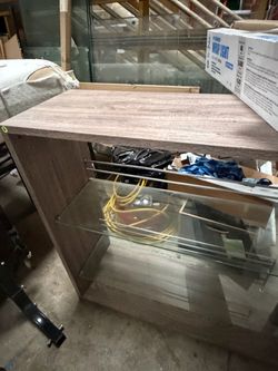 Bar with glass shelf