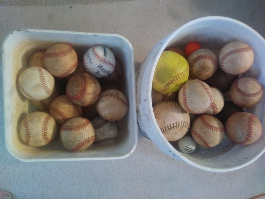 2 buckets of Baseballs mostly some softballs some golf balls two buckets of balls first 100 takes all and one glove