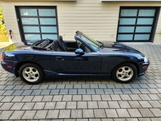 Have you ever wanted to go topless? Check out this blue Miata convertible