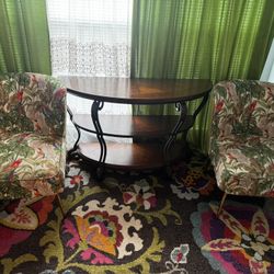 Two chairs with a large table 