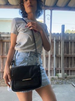 Cute black leather Coach Taylor Mini Flap Crossbody bag with silver-toned hardware.