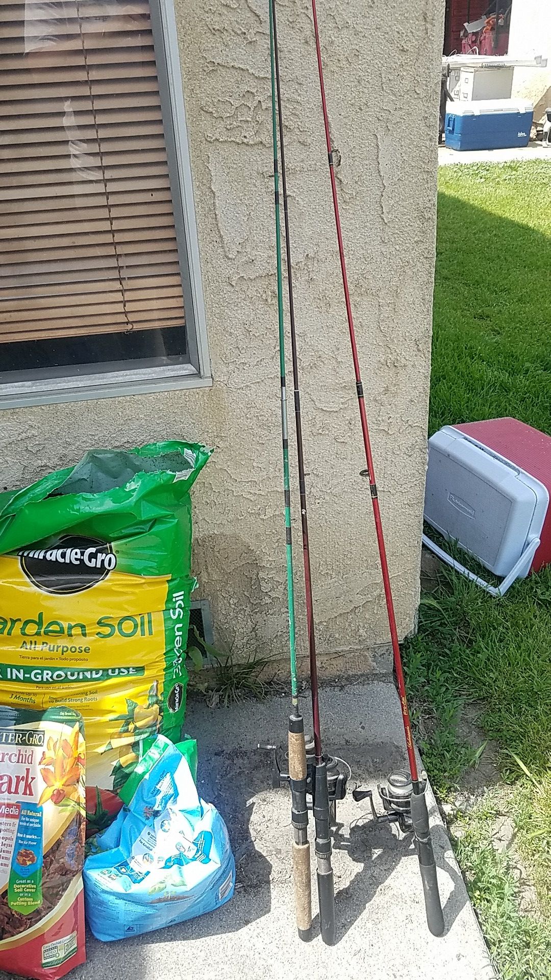 3 fishing poles w/line and reel