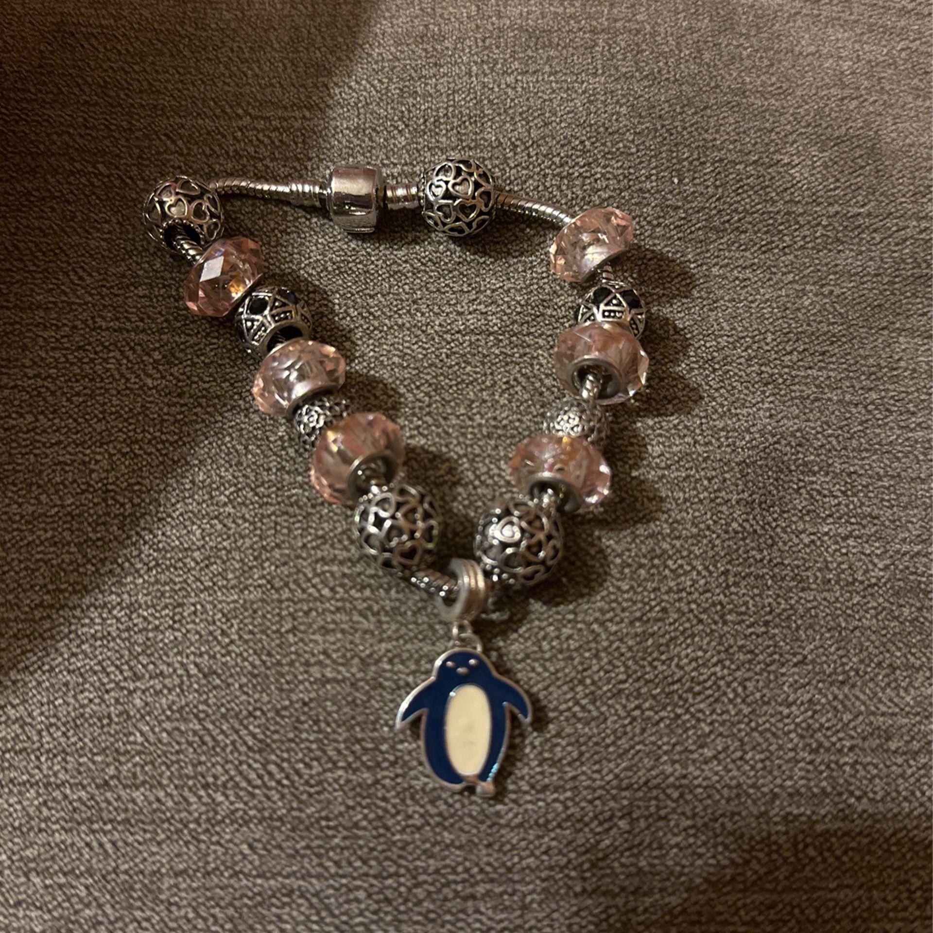 Bracelet, Silver With Pink and Silver Charms With A Penguin Charm