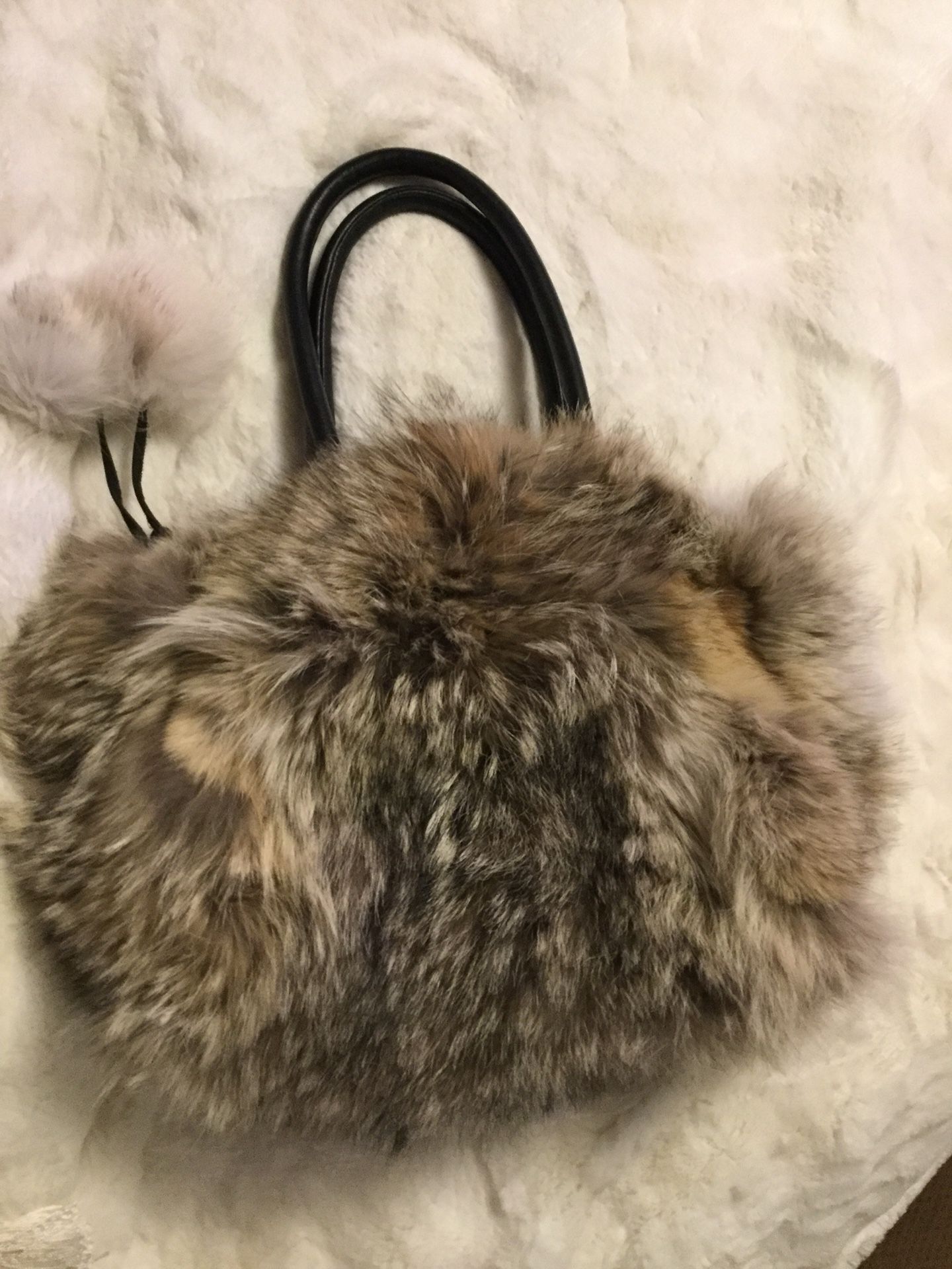 Coyote fur purse with Pom poms and soft black leather so soft