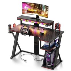 57 in. Black L Shape Gaming Desk with LED Lights Monitor Stand Power Outlets Cup Holder and Headphone Hook