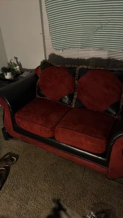 Red and Black Loveseat with Throw Pillows