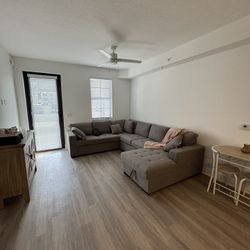 GRAY SLEEPER PULL OUT SOFA WITH STORAGE