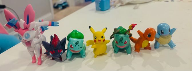 A bundle of Pokémon figurines