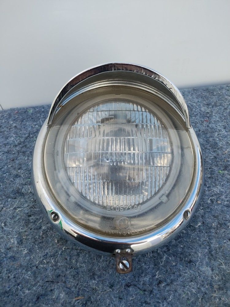 VW Single early bug headlight with eye lid $40