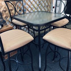 patio bistro set! four swivel chairs in good condition! table and high chairs