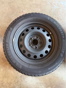 Four Michelin X-Ice stud-less snow tires on rims
