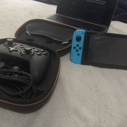 Nintendo Switch And A Nintendo Pro Controller 