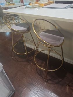 Gold and grey swivel counter height bars