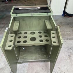Repurposed vintage bar cabinet for storing organizing bars & bottles painted in distressed  green This unit is on wheels and comes with key. Please wa